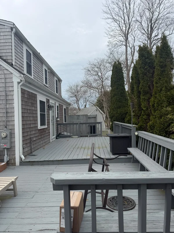 Deck seating area with table and railings