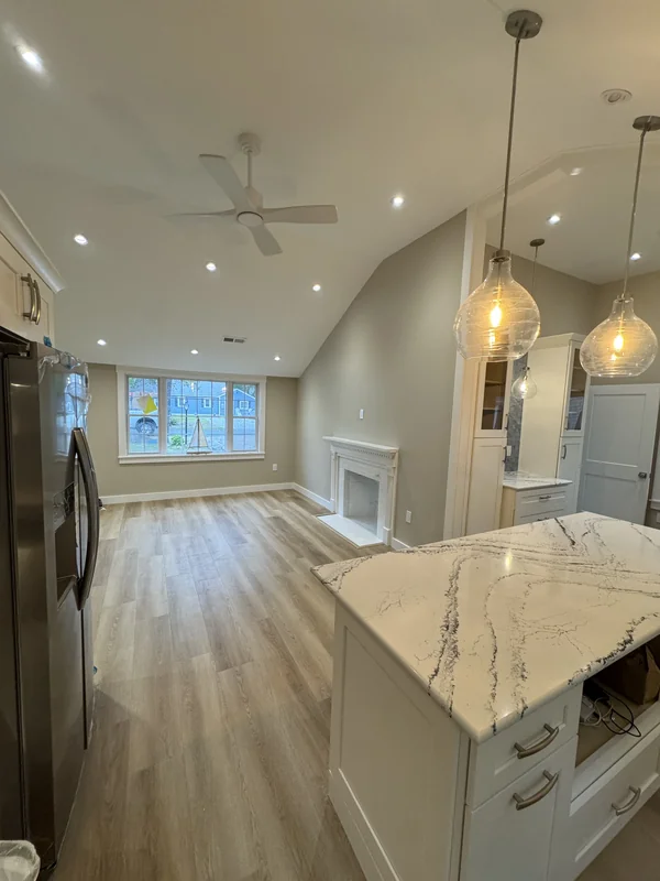 Open kitchen view with island and vaulted ceiling