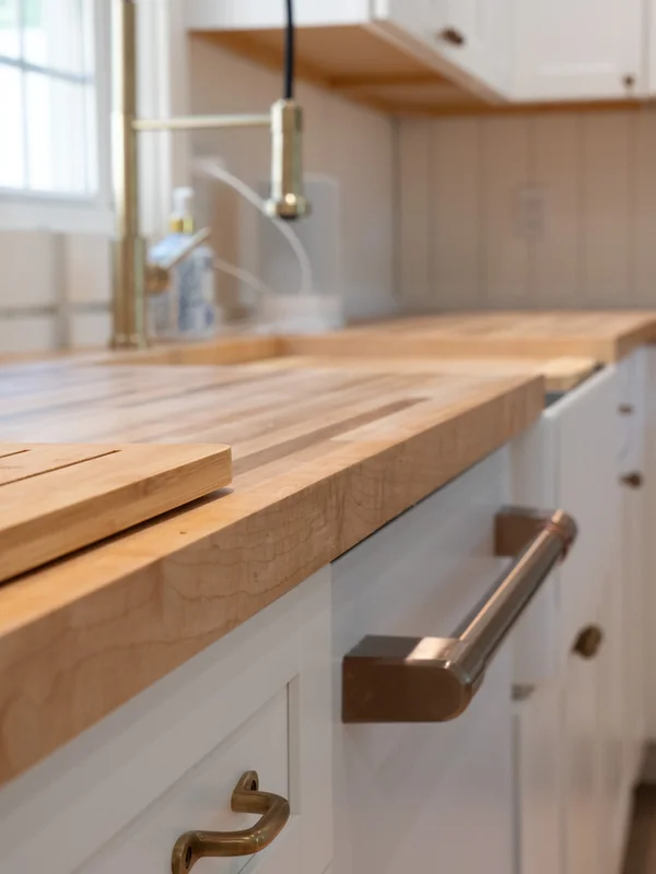 Kitchen countertop close-up with sink and cabinet hardware