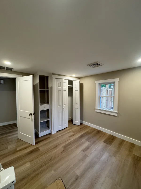 Finished room with light flooring, closet storage, and recessed lighting