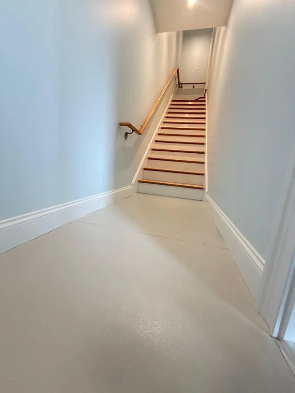 Freshly painted stair hallway with light blue-gray walls