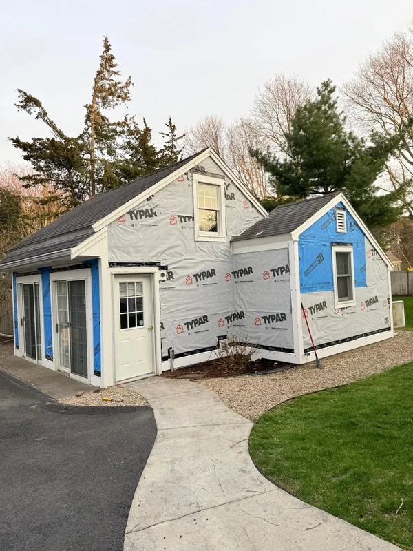 Detached structure with new siding, trim, doors, and walkway