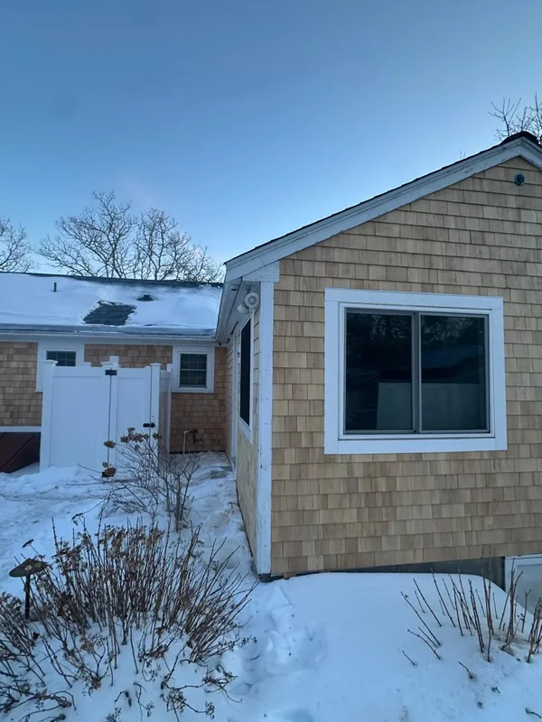 Front exterior with cedar shingle siding and white trim