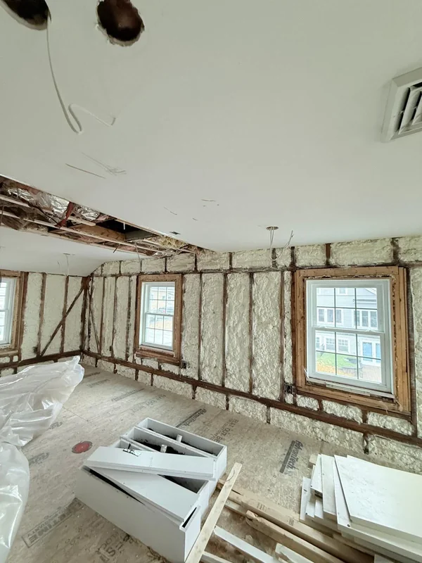 Spray foam insulation installed along framed interior walls