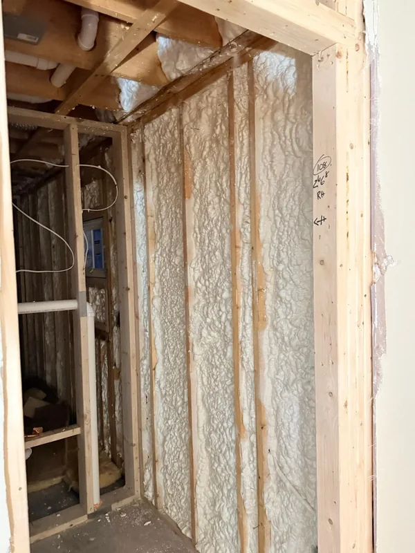 Close-up of spray foam insulation in wall framing