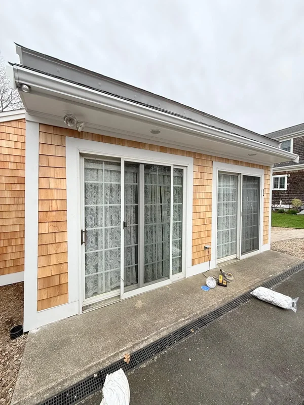 Exterior wall with large windows and clean white trim
